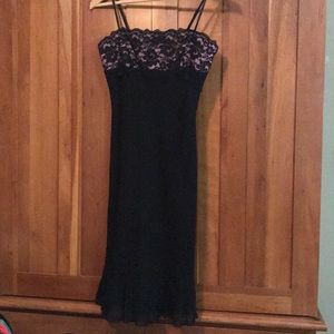 Black cocktail dress with lace detailing